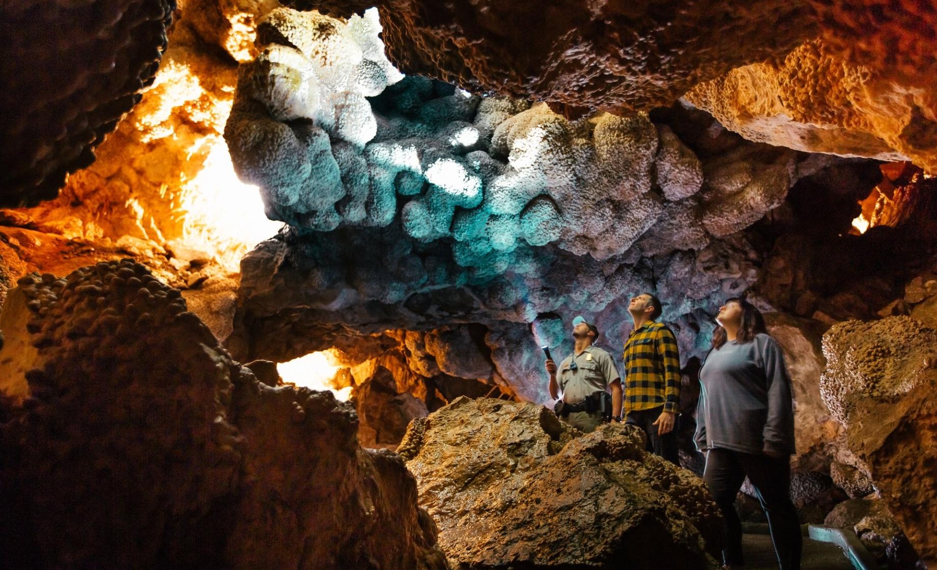 A couple and their tour guide in Jewel Cave National Monument.