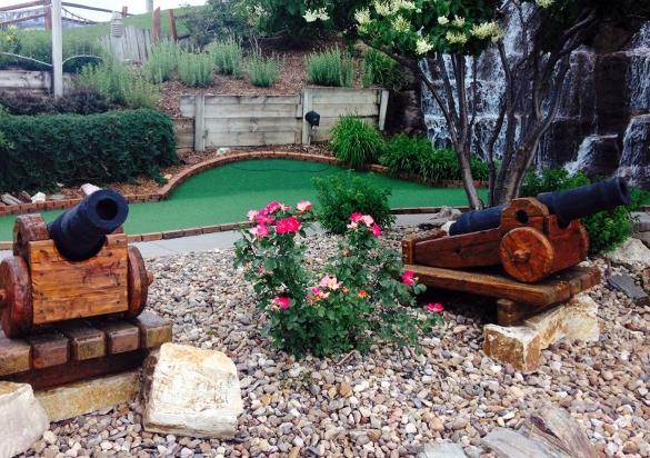 Two cannons stand outside a hole at this pirate-themed mini golf course in Rapid City